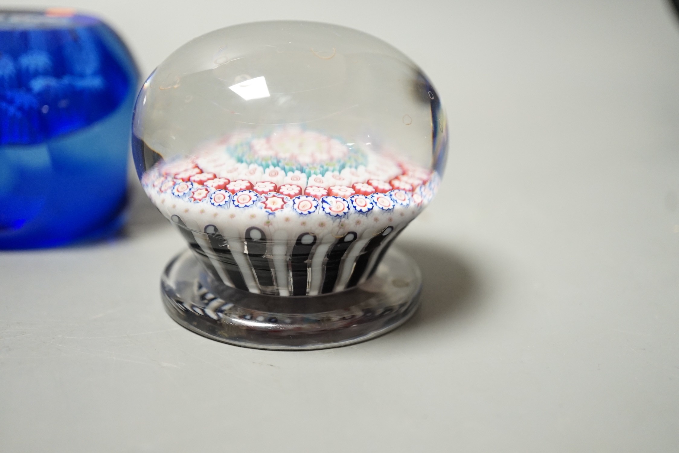 Three millefiori glass paperweights, largest 8cm diameter